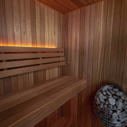 Interior corner of the CT Element Loft: upper and lower benches, backrest and the stone-filled heater basket