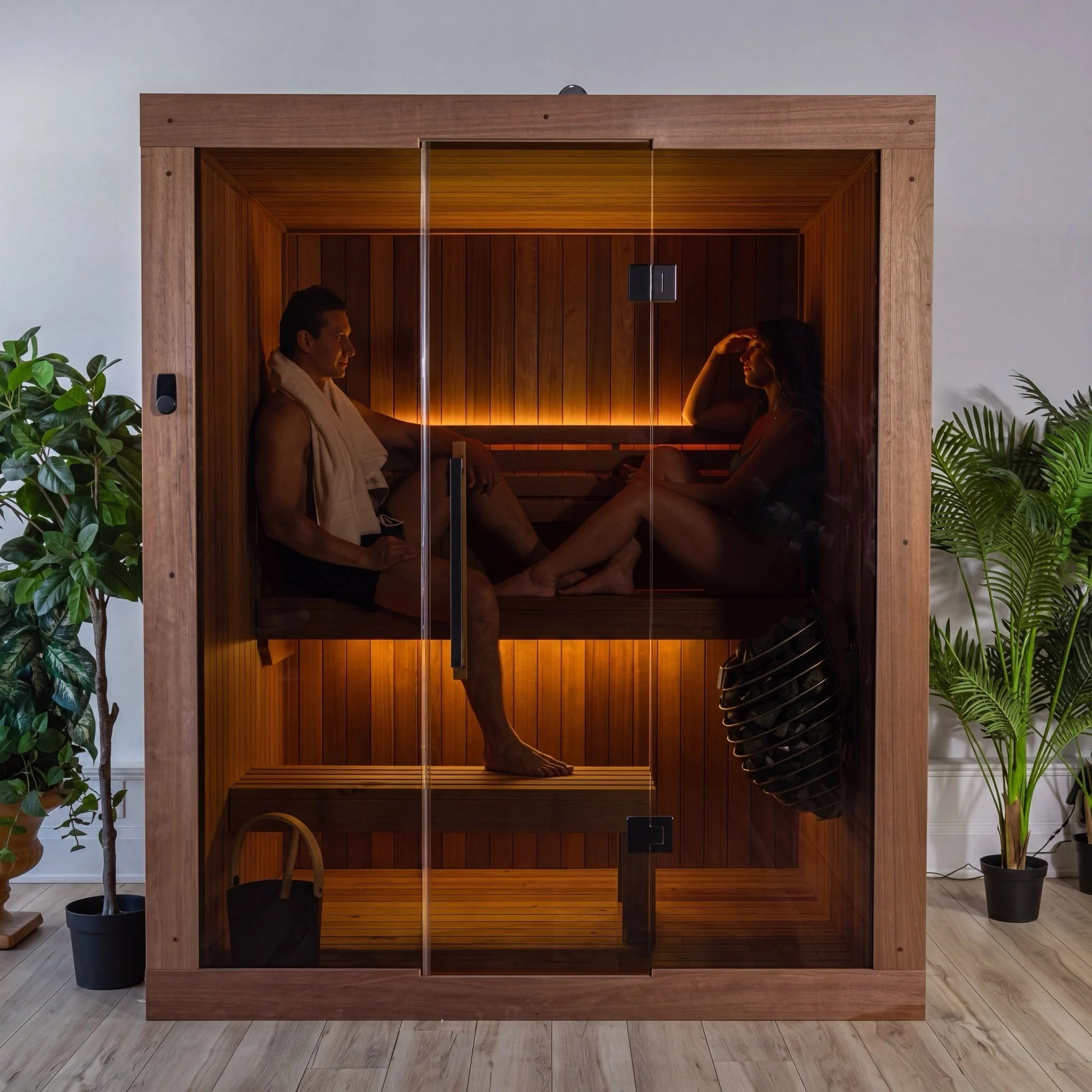 CT Element Loft indoor sauna seen head on with two people on the bench inside