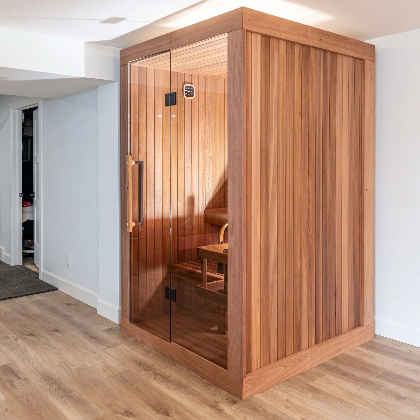 Dundalk LeisureCraft CT Element Nook indoor sauna installed in a finished basement, full glass door in a Thermo Grandis frame