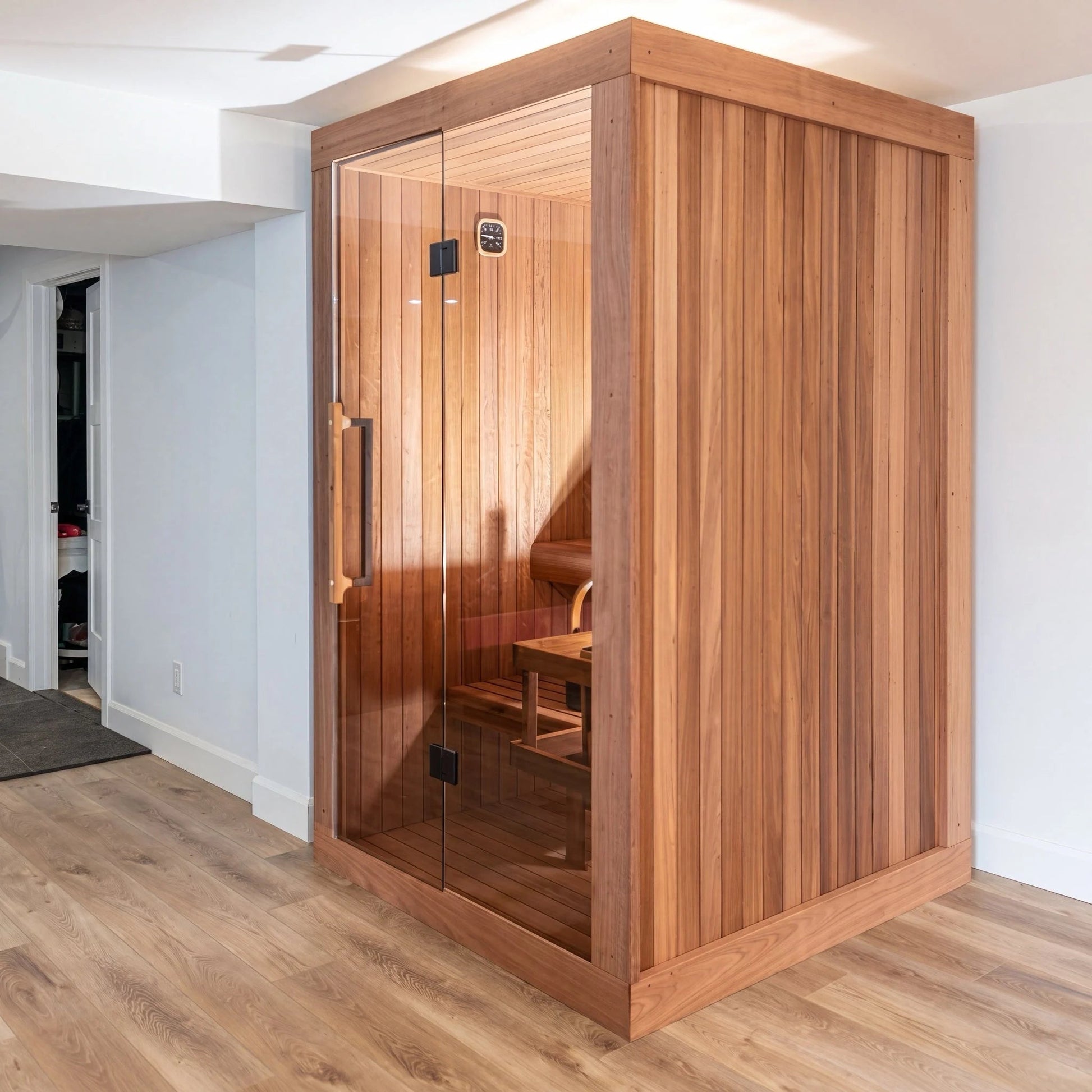 Dundalk LeisureCraft CT Element Nook indoor sauna installed in a finished basement, full glass door in a Thermo Grandis frame