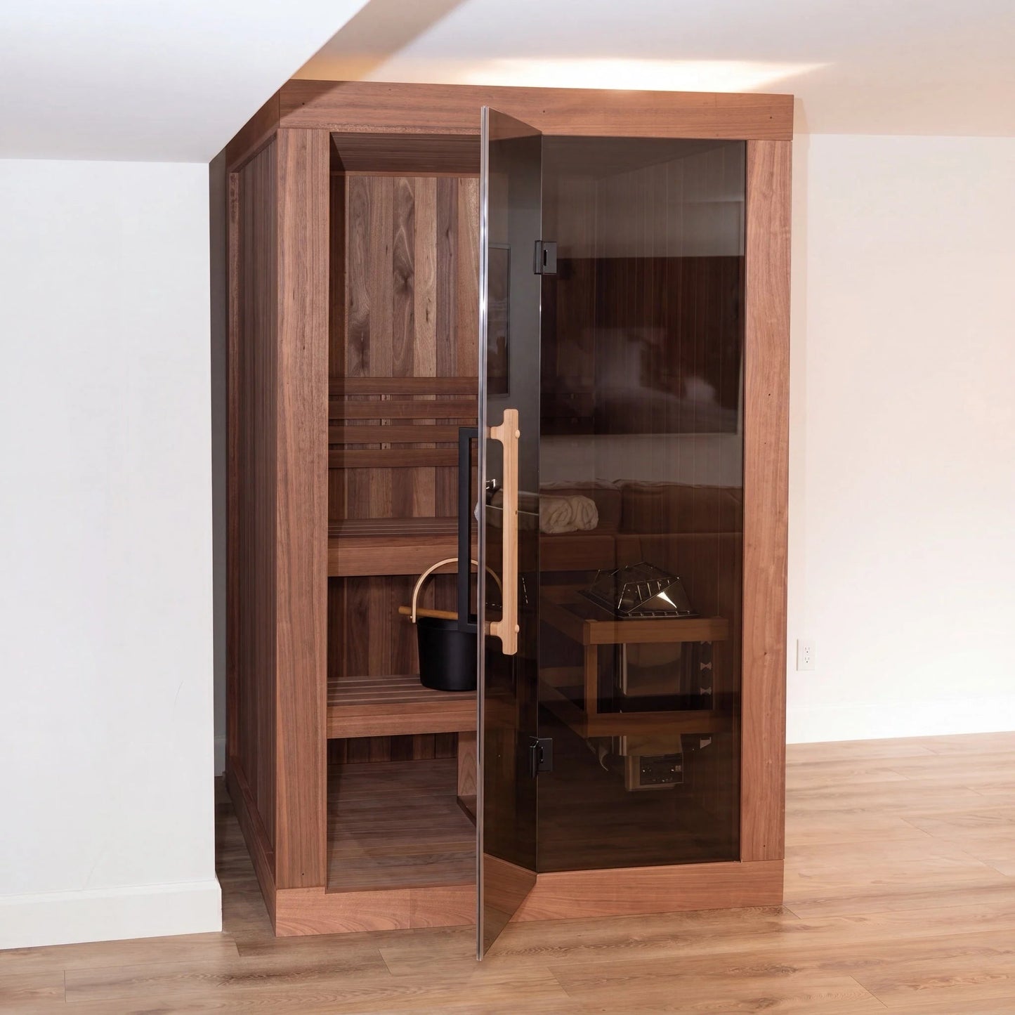 CT Element Nook indoor sauna standing in a light room, glass door ajar