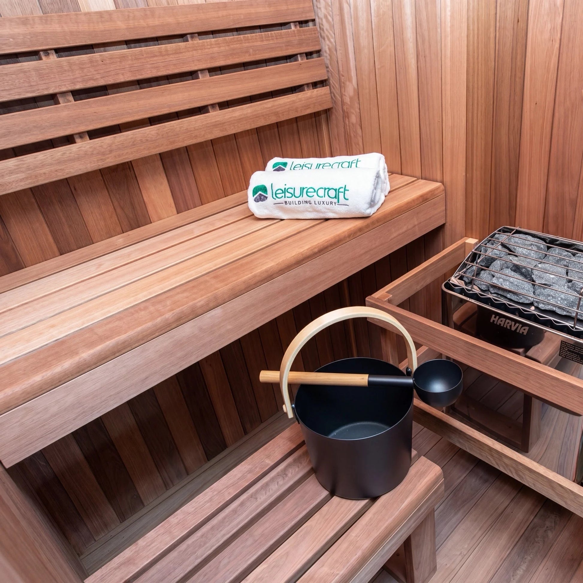 Electric heater and stones set beside the lower bench inside the CT Element Nook