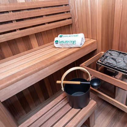 Electric heater and stones set beside the lower bench inside the CT Element Nook