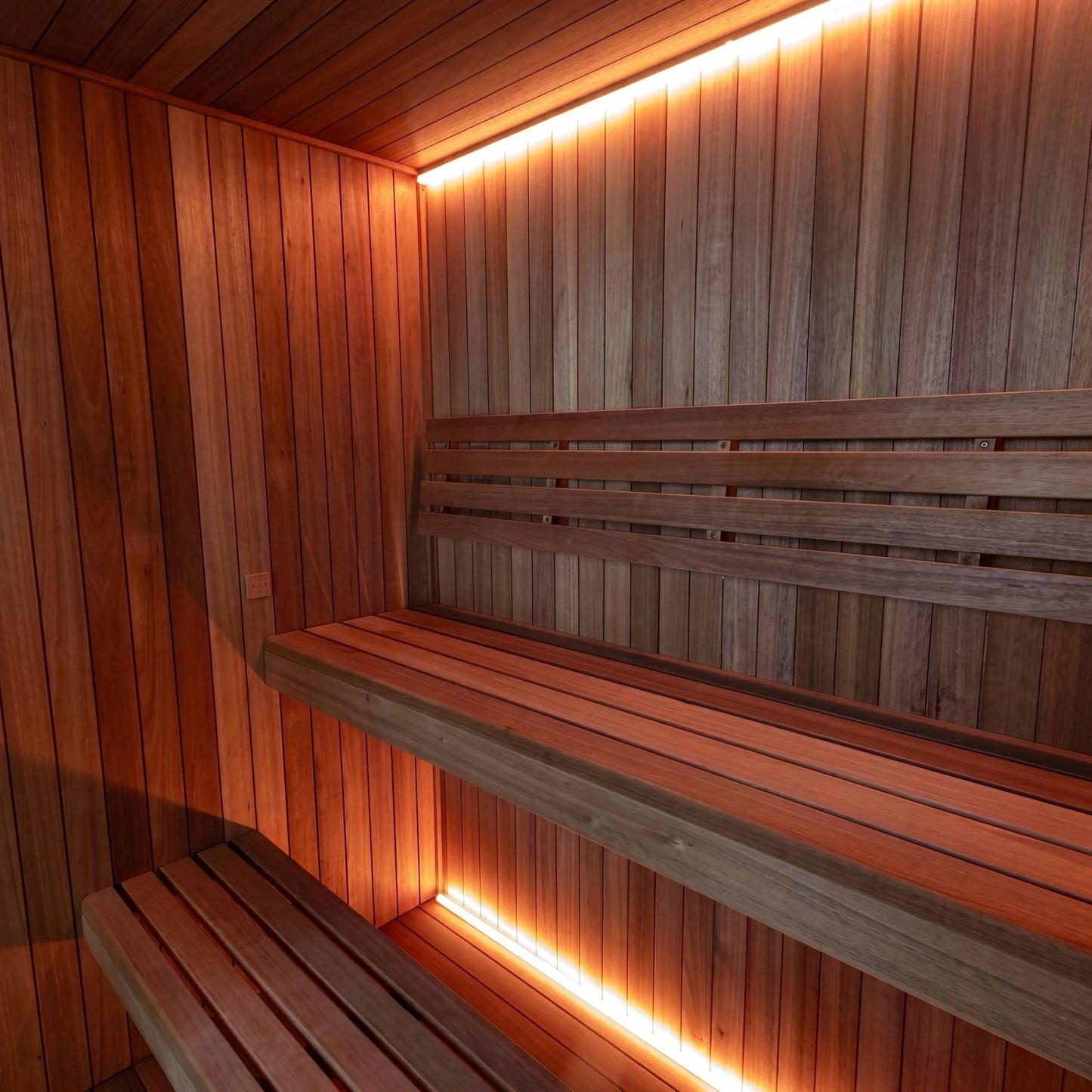 Wide view of the CT Element Studio interior showing the L-shaped benching and cove lighting