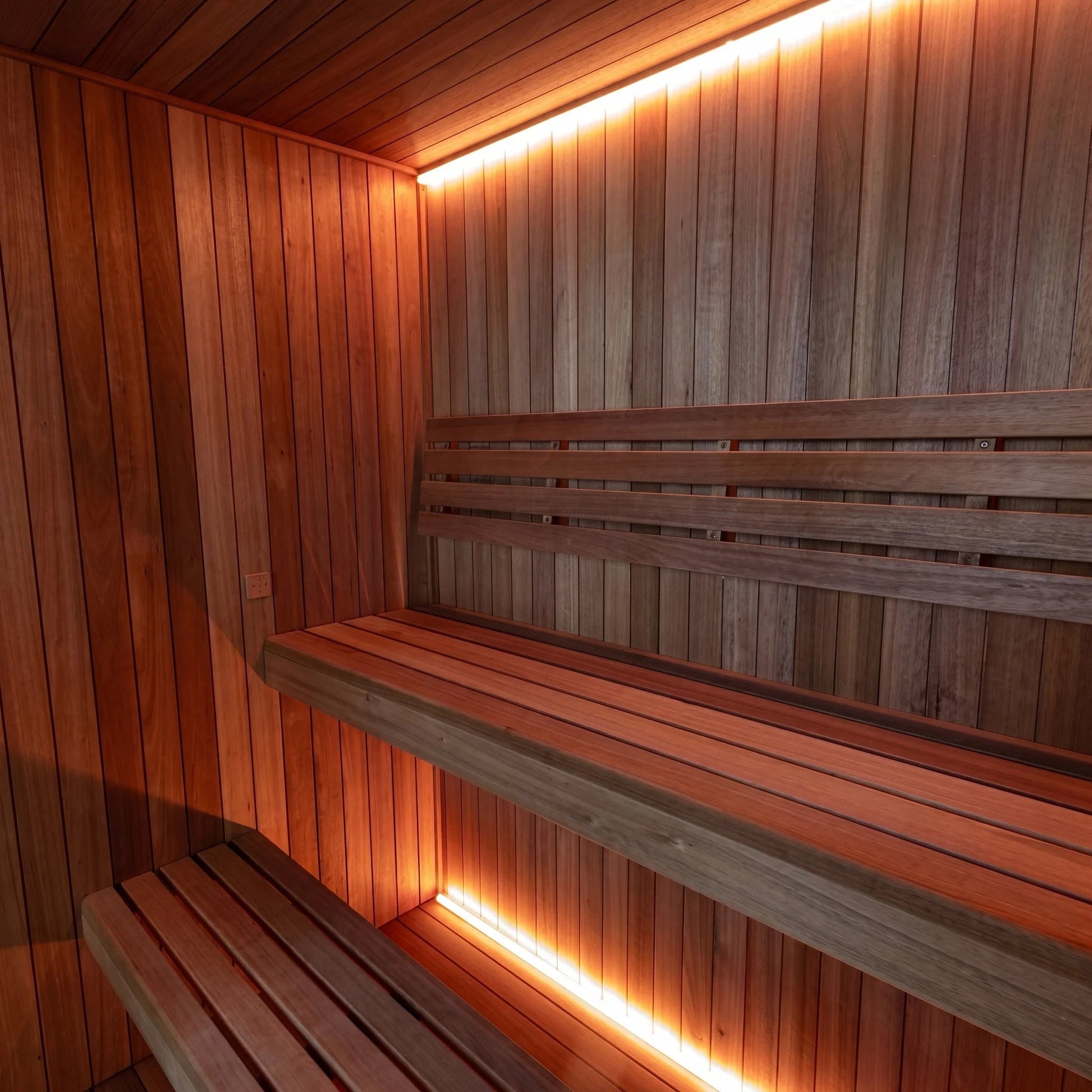 Wide view of the CT Element Studio interior showing the L-shaped benching and cove lighting