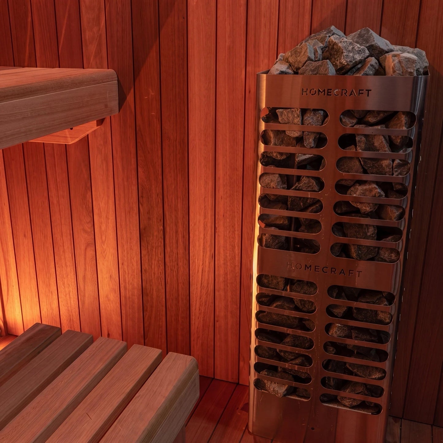 Tall Homecraft pillar heater filled with sauna stones inside the CT Element Studio