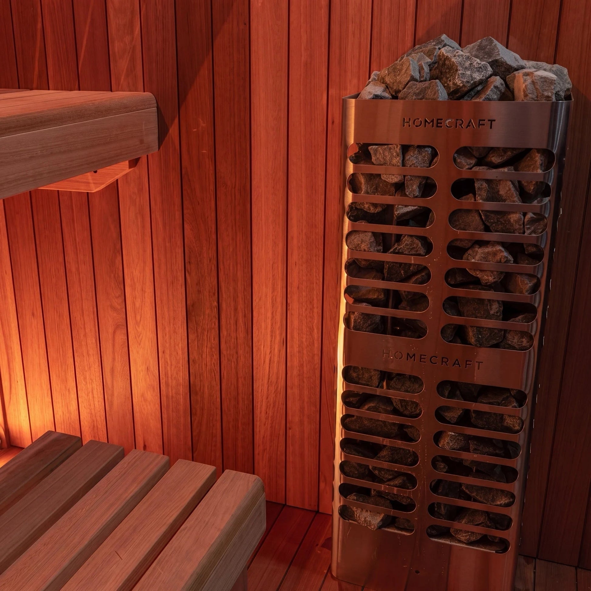 Tall Homecraft pillar heater filled with sauna stones inside the CT Element Studio