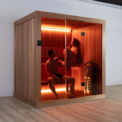 Two people inside the CT Element Studio, one standing at the bench