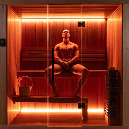 One person seated centrally on the bench inside the CT Element Studio, seen through the glass front