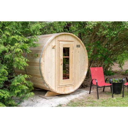 CT Harmony outdoor barrel sauna seen head on, showing the round cedar end wall and glass door
