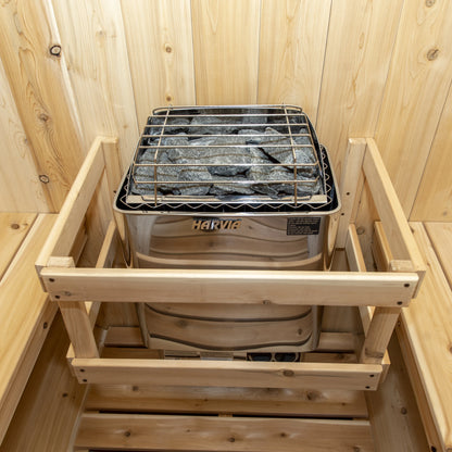 Harvia electric heater and its cedar guard rail inside the CT Harmony barrel sauna