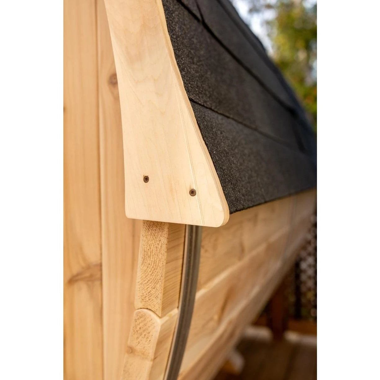 Shingle roof edge and cedar trim detail on the CT Harmony barrel sauna