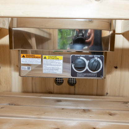 Heater control panel with timer and thermostat dials inside the CT Harmony barrel sauna