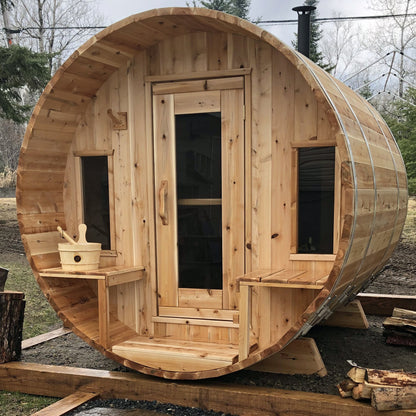 Dundalk LeisureCraft CT Tranquility barrel sauna outdoors, covered front porch with benches either side of the door