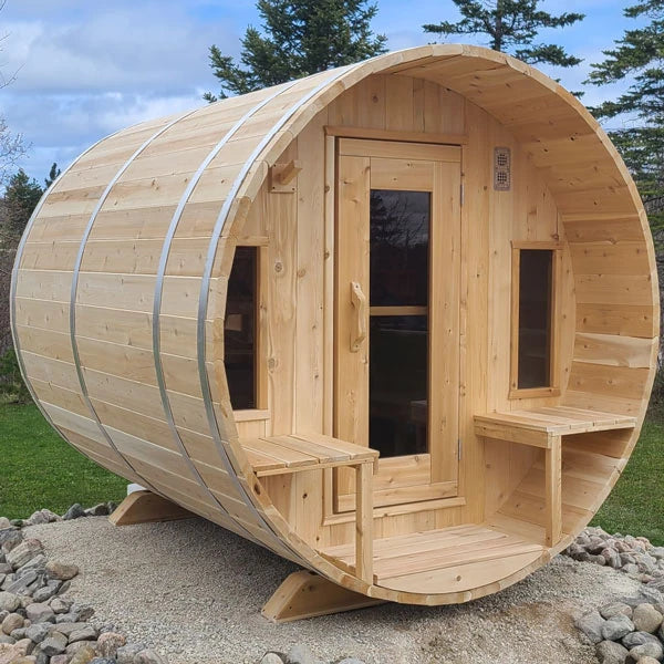 CT Tranquility barrel sauna on a gravel pad, showing the ten-foot barrel and porch