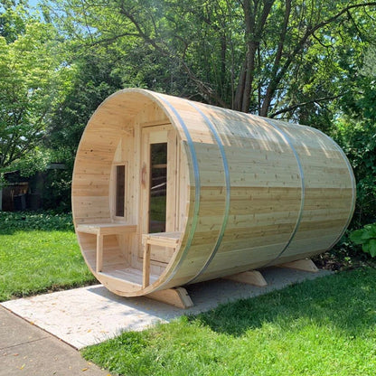 CT Tranquility barrel sauna on a lawn beside a paved path
