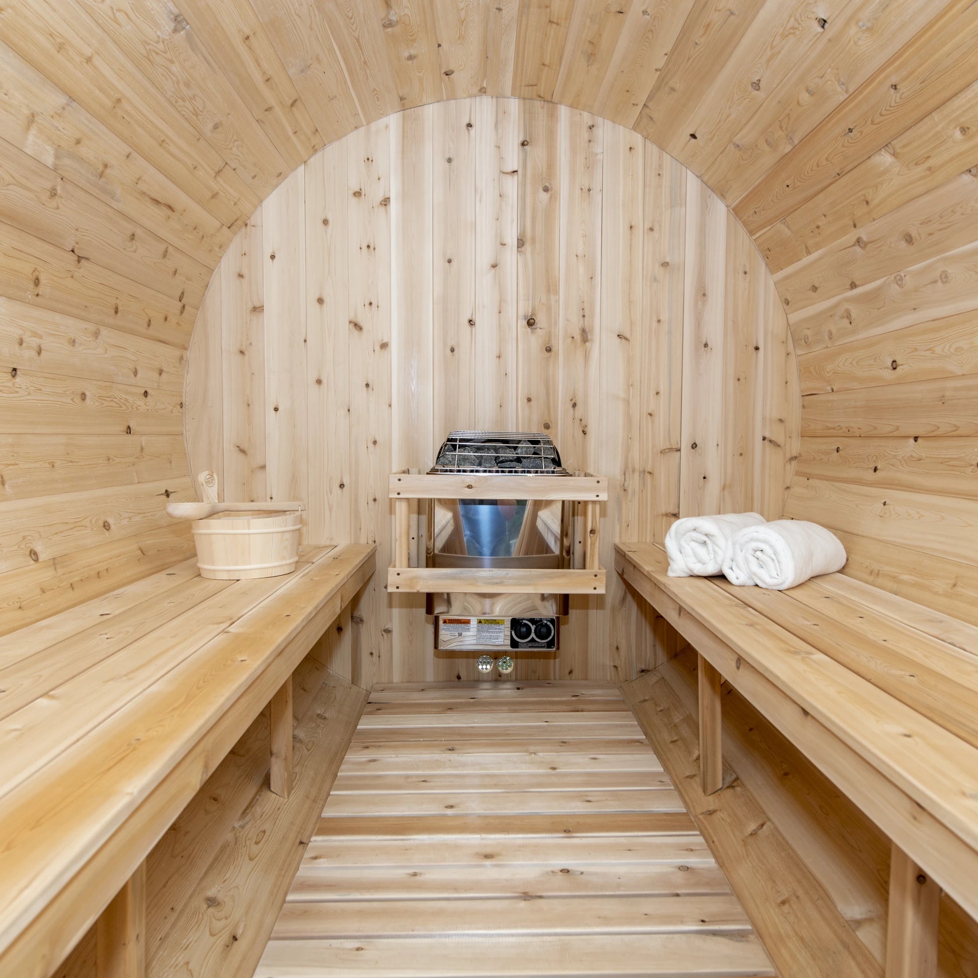 Inside the CT Tranquility barrel sauna: nearly eight feet of facing cedar benches and slatted floor