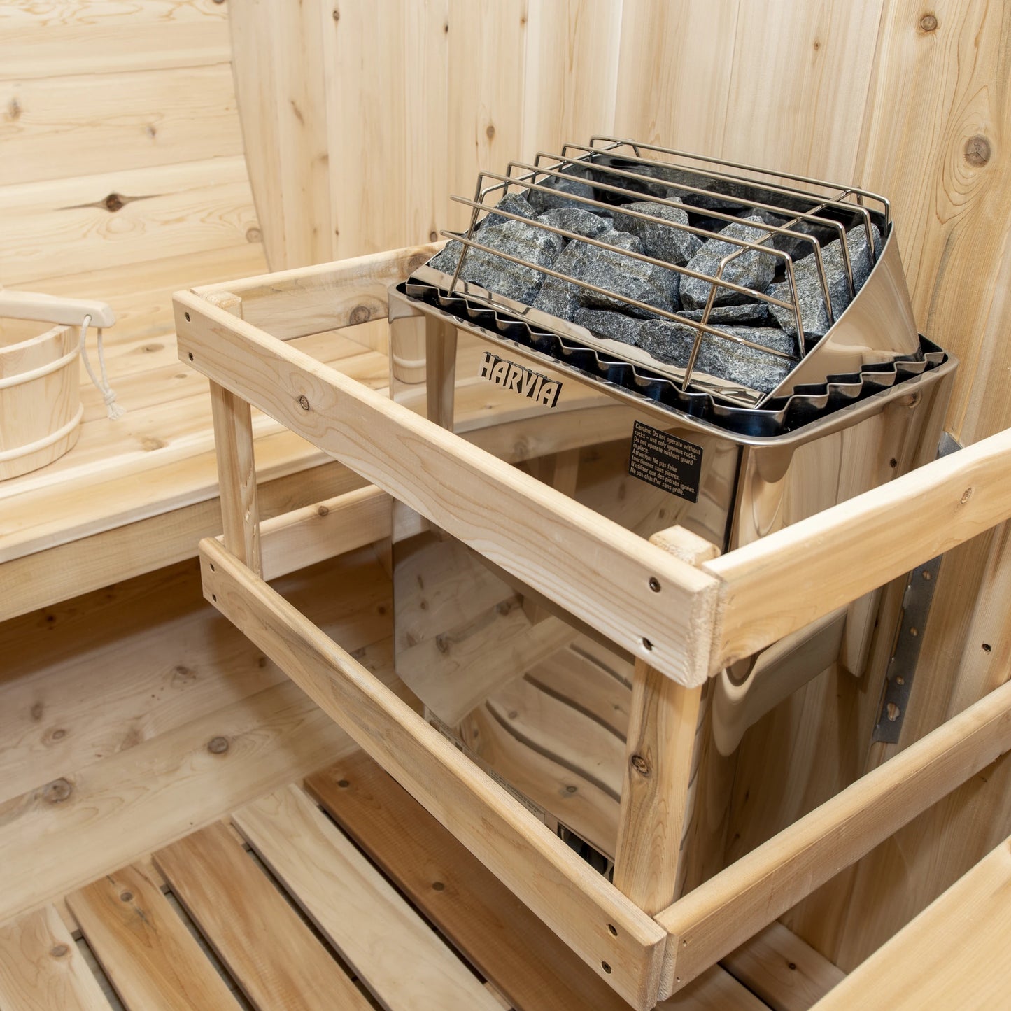 Harvia electric heater and cedar guard inside the CT Tranquility barrel sauna