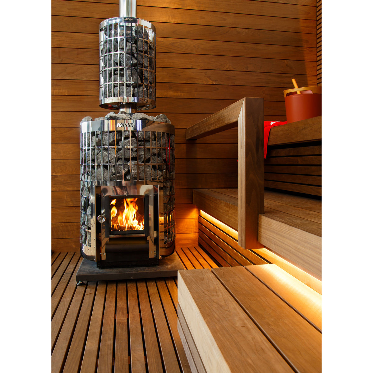 Harvia Cilindro 16 16kW in a warmly lit sauna with slatted benches