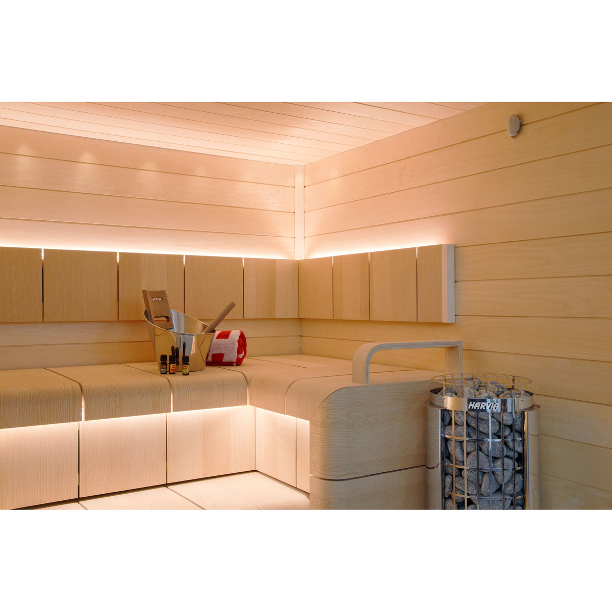 Harvia Cilindro PC110E 10.5kW in a light timber sauna with backlit benches