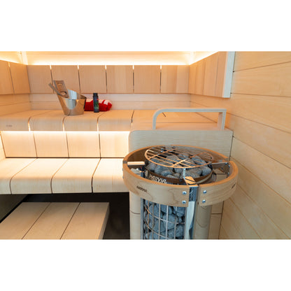 Harvia Cilindro PC110E 10.5kW with a timber safety railing, beside the upper bench of a light sauna