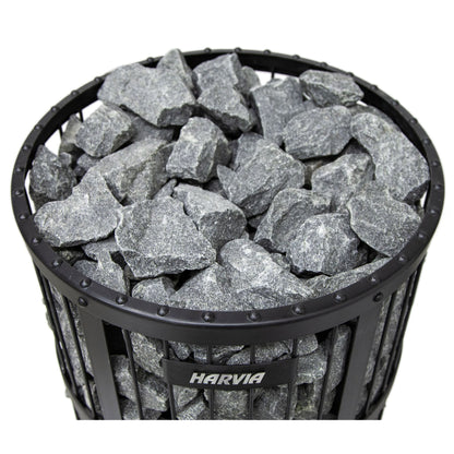 Top view of the sauna stones stacked in the round steel basket of the Harvia Legend stove