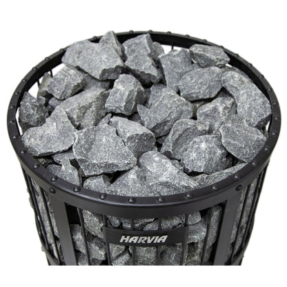 Top view of the sauna stones stacked in the round steel basket of the Harvia Legend stove