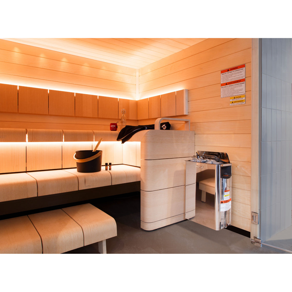 Harvia The Wall SW60 6kW in a light sauna with backlit benches