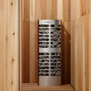 Homecraft Revive Slim heater standing in the corner of a cedar sauna, filled with stones