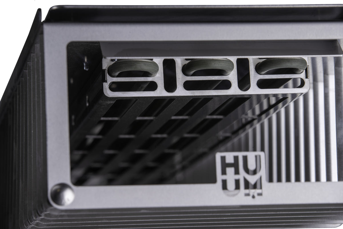 Top of the HUUM CLIFF Mini 4 sauna heater with the HUUM logo