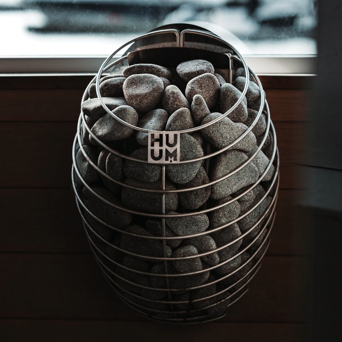 HUUM DROP 4 sauna heater mounted in a sauna