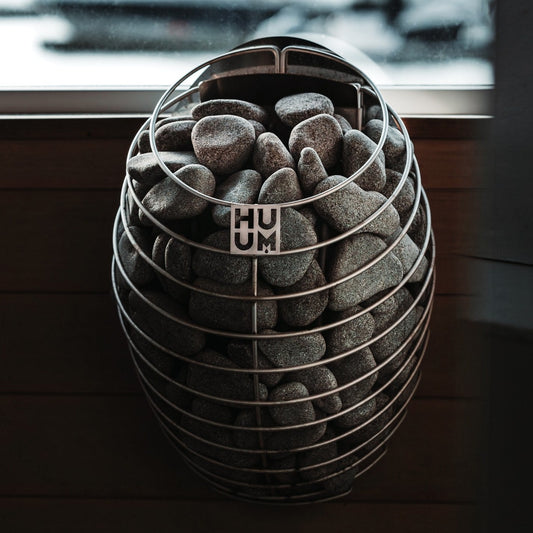 HUUM DROP 4 sauna heater mounted in a sauna