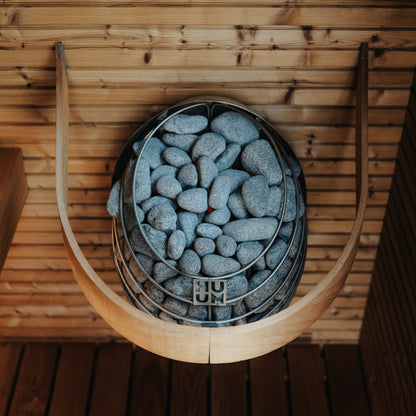 HUUM DROP in a sauna with the HUUM DROP safety rail (sold separately) fitted