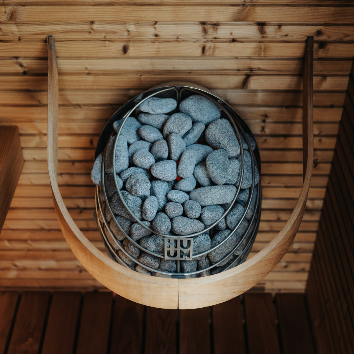 HUUM DROP in a sauna with the HUUM DROP safety rail (sold separately) fitted