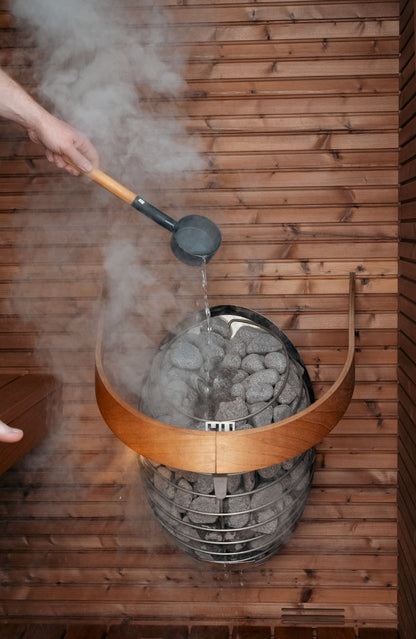 Water ladled onto a HUUM DROP heater fitted with the safety rail