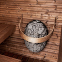 HUUM DROP safety railing fitted around the stone basket of a DROP heater