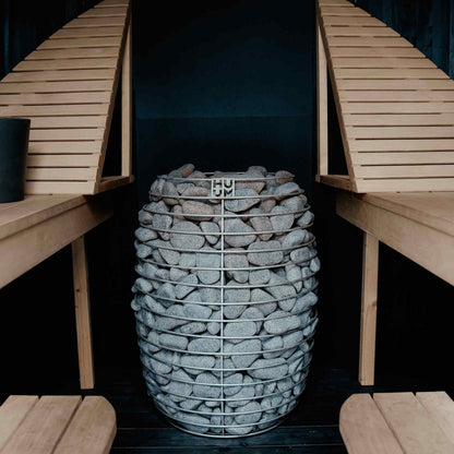 HUUM HIVE 12 sauna heater between sauna benches