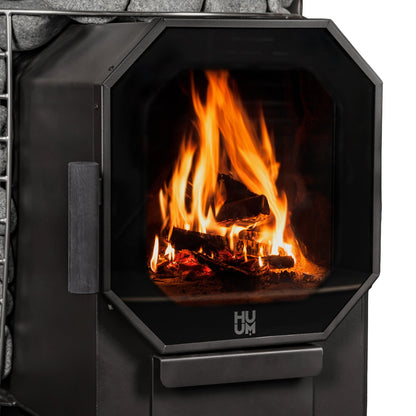 Fire behind the glass door of the HUUM HIVE Flow sauna stove