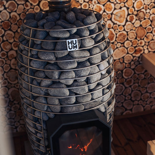 HUUM HIVE FLOW wood burning sauna stove in a sauna