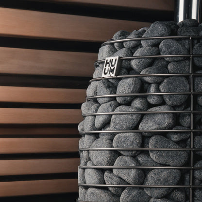Sauna stones in the steel cage of the HUUM HIVE Flow LS stove