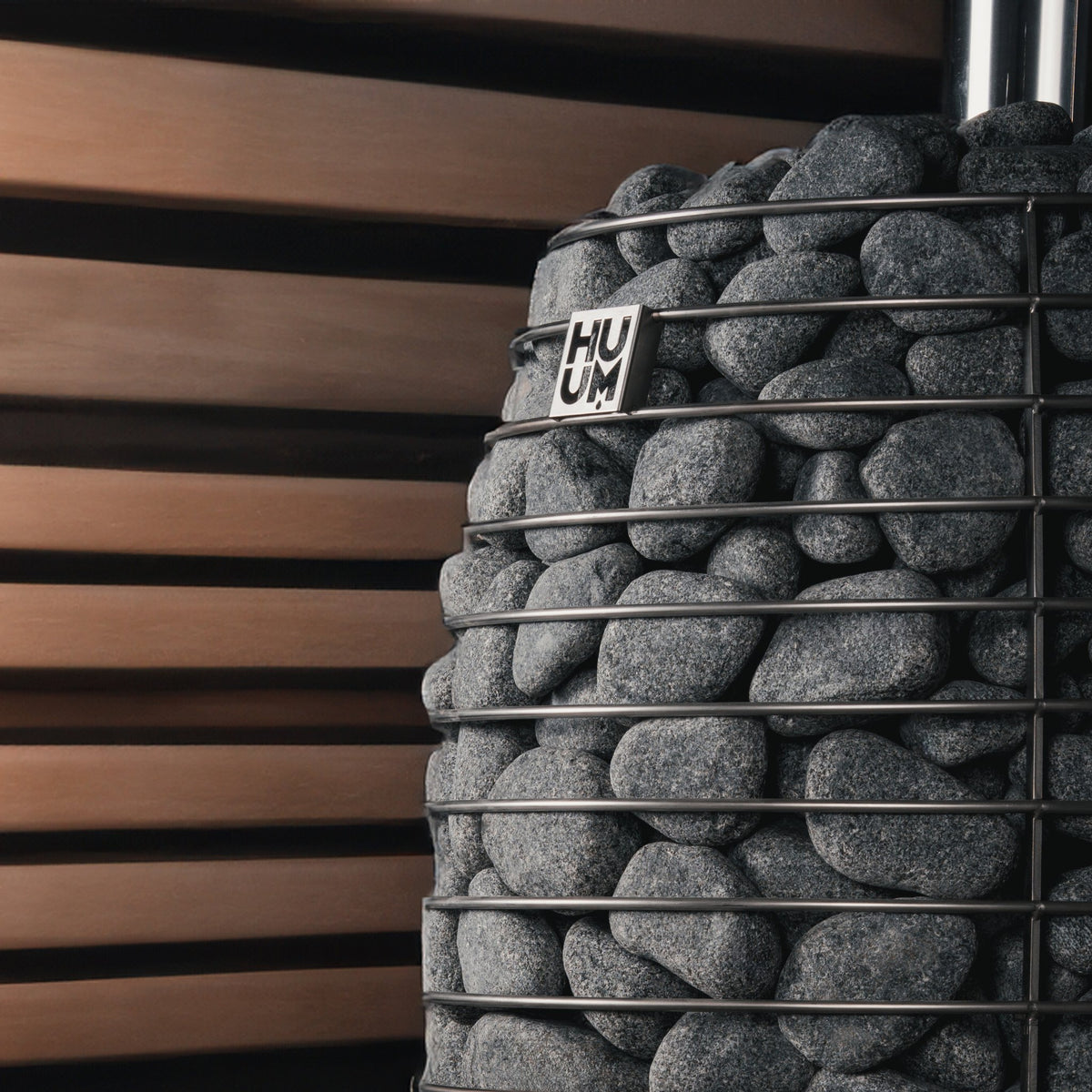 Sauna stones in the steel cage of the HUUM HIVE Flow stove