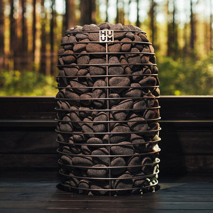 HUUM HIVE Mini 11 sauna heater with a forest view