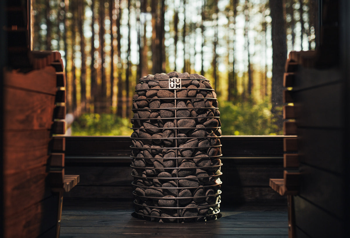HUUM HIVE Mini in a sauna with a forest window
