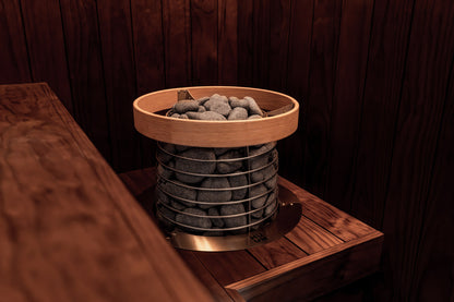 HUUM HIVE Mini with its safety rail in a sauna