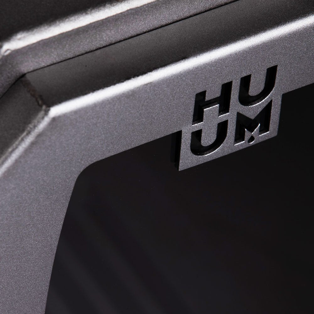 HUUM logo on the door of the HIVE Wood 17 LS sauna stove