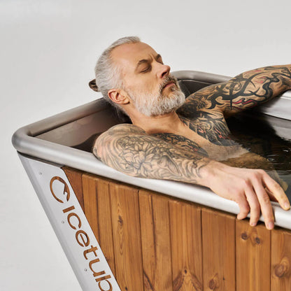 Icetubs IceBath Thermowood & Stainless Steel Cold Plunge Tub, bather reclined against the 60 degree backrest