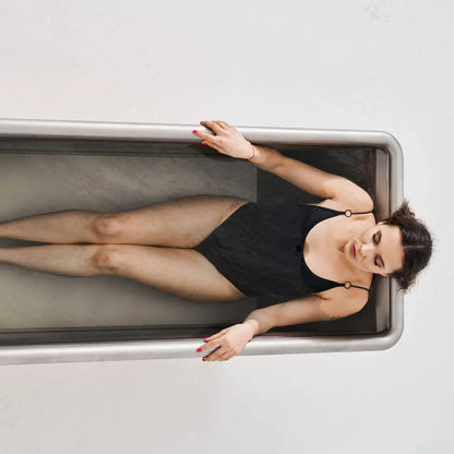 Icetubs IceBath Thermowood & Stainless Steel Cold Plunge Tub, overhead view of a bather lying full length in the stainless steel interior