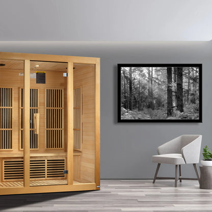 Lifestyle room view of the Maxxus Bellevue 3-Person Low EMF FAR Infrared Sauna, highlighting the natural Canadian Hemlock wood finish. Model MX-J306-01.