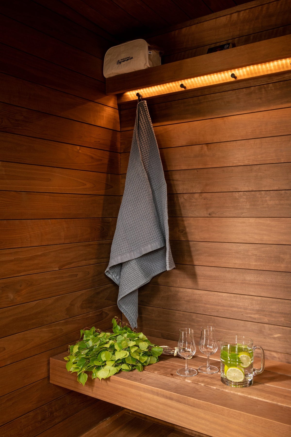 Changing Room interior detail, cedar hook rail with a towel and a shelf below