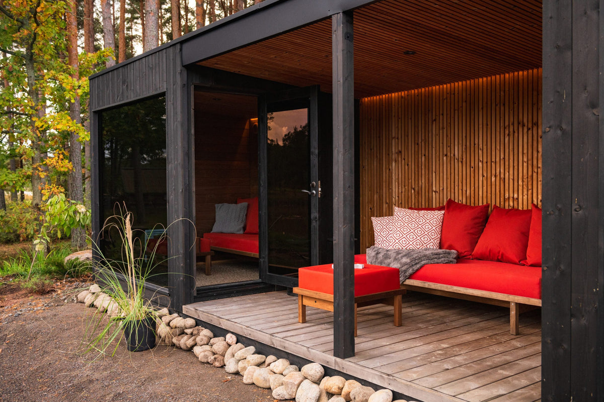 Nordic Misty Lounge on a timber deck with outdoor seating and planting